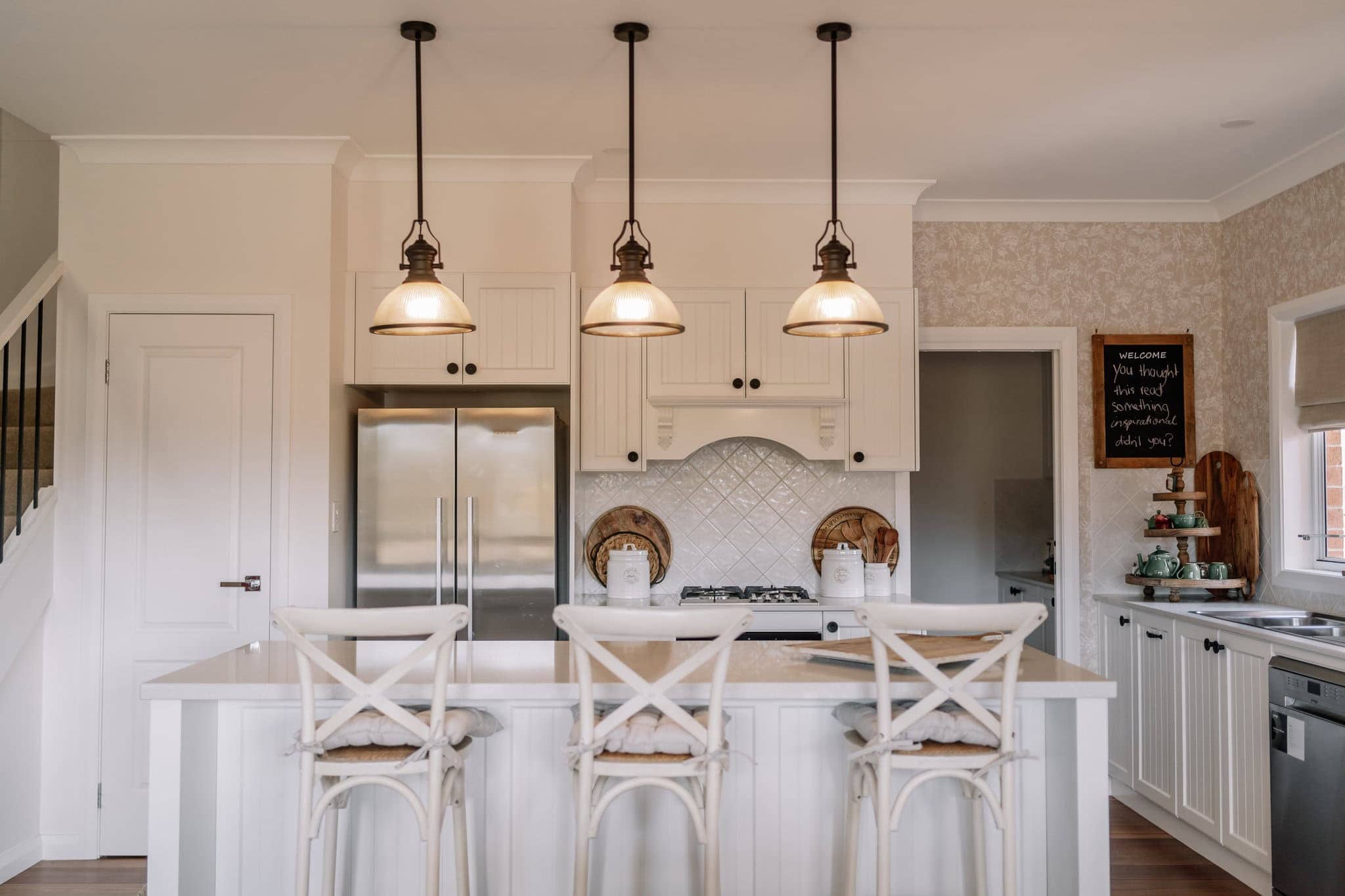 Modern kitchen with white cabinetry and island, perfect for family living and entertaining.
