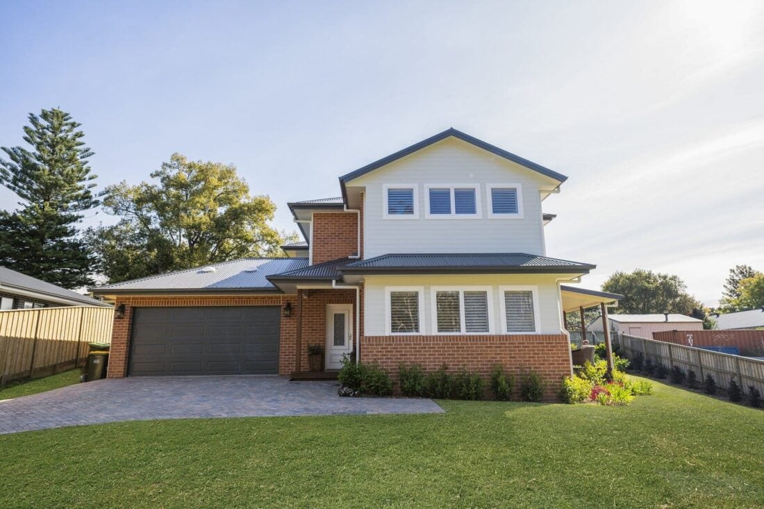 Modern custom-designed family home with brick and weatherboard exterior in a peaceful neighbourhood.