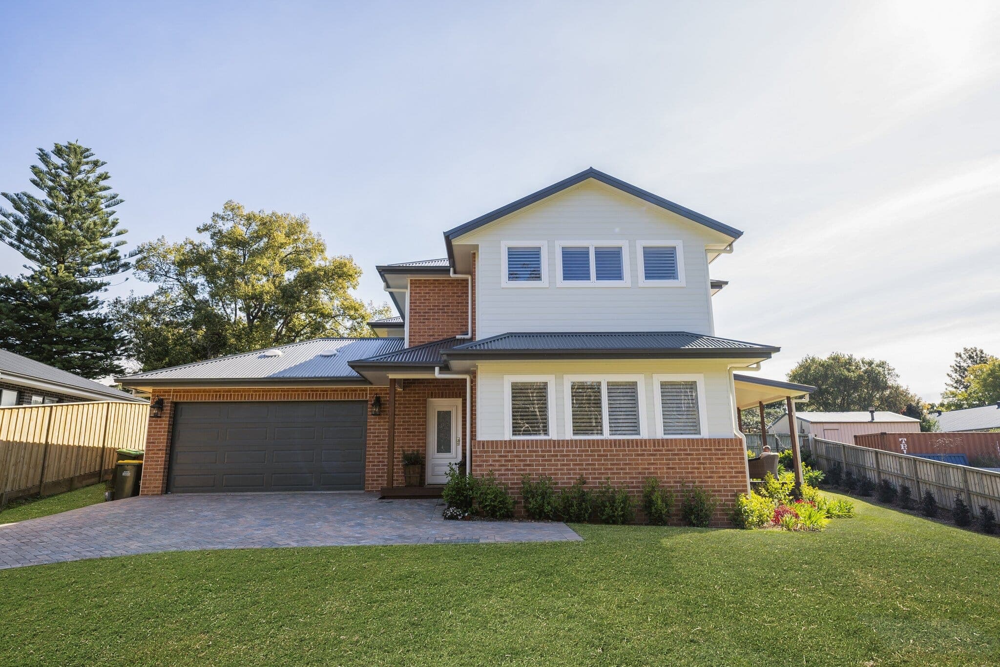 Modern custom-designed family home with brick and weatherboard exterior in a peaceful neighbourhood.