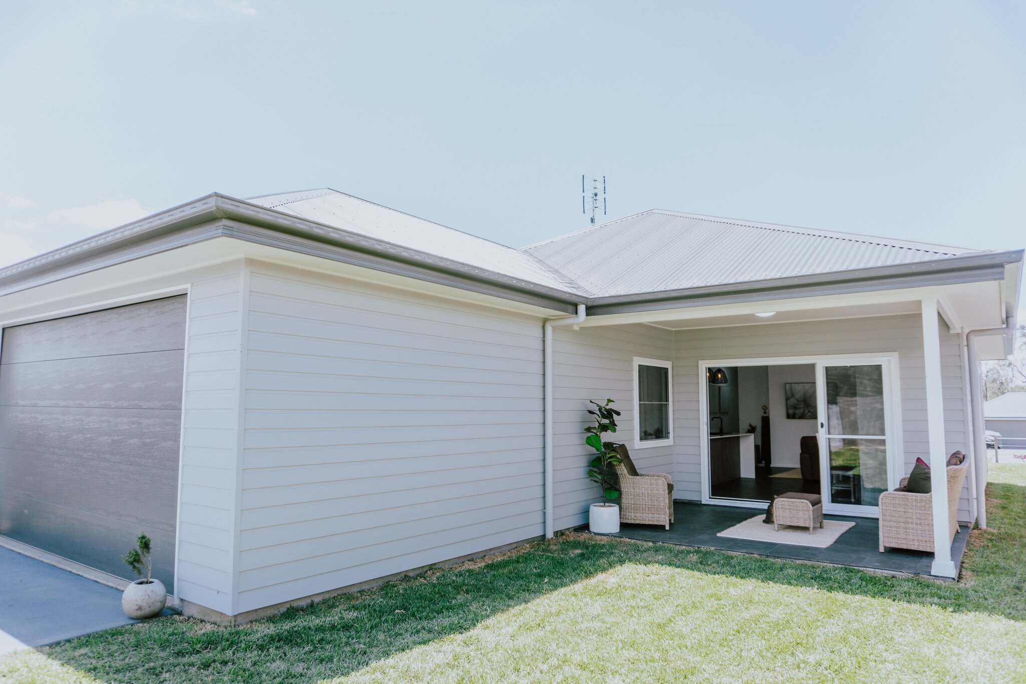 Modern white family home with outdoor patio, perfect for Australian lifestyles.