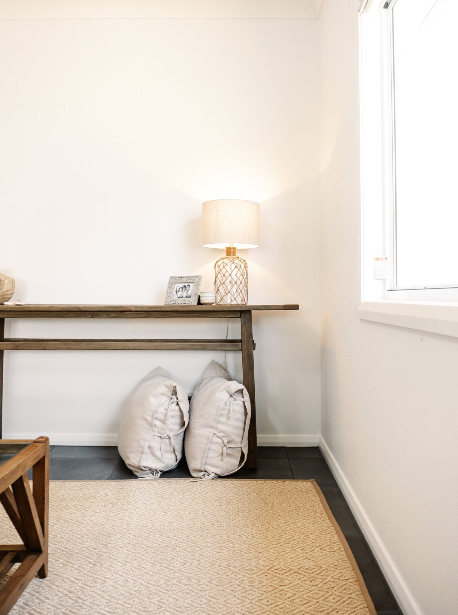 Cozy bedroom corner with neutral tones and stylish decor, perfect for modern Edwards Family Homes.