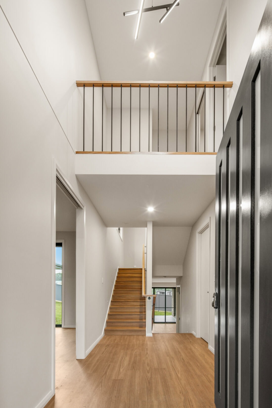 Modern two-storey home interior with staircase and open balcony. showing how Multi-Generational Second-Storey Extensions in Nirimba Fields can be achieved