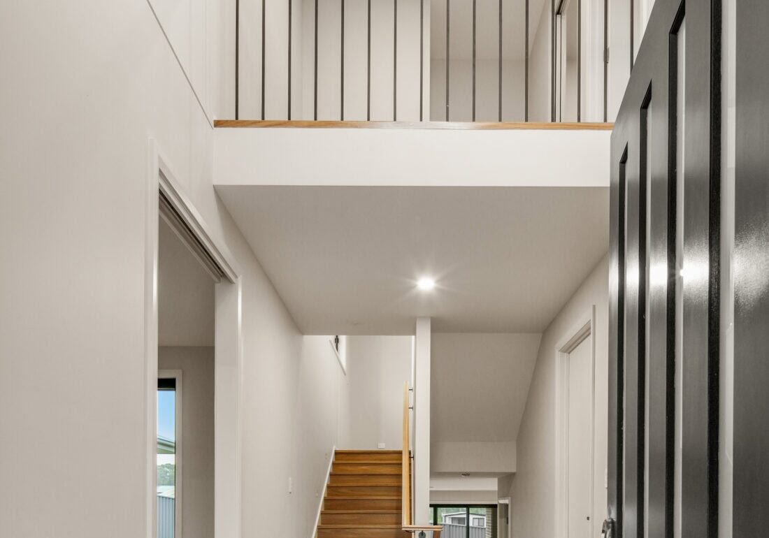 Modern two-storey home interior with staircase and open balcony. showing how Multi-Generational Second-Storey Extensions in Nirimba Fields can be achieved