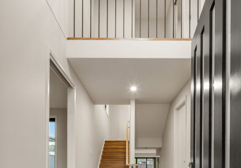 Modern two-storey home interior with staircase and open balcony. showing how Multi-Generational Second-Storey Extensions in Nirimba Fields can be achieved