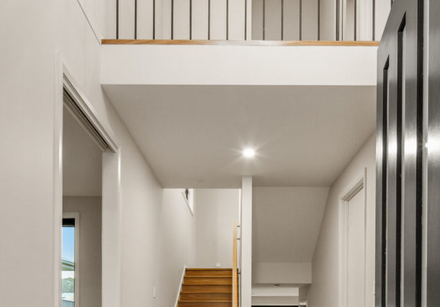 Modern two-storey home interior with staircase and open balcony. showing how Multi-Generational Second-Storey Extensions in Nirimba Fields can be achieved