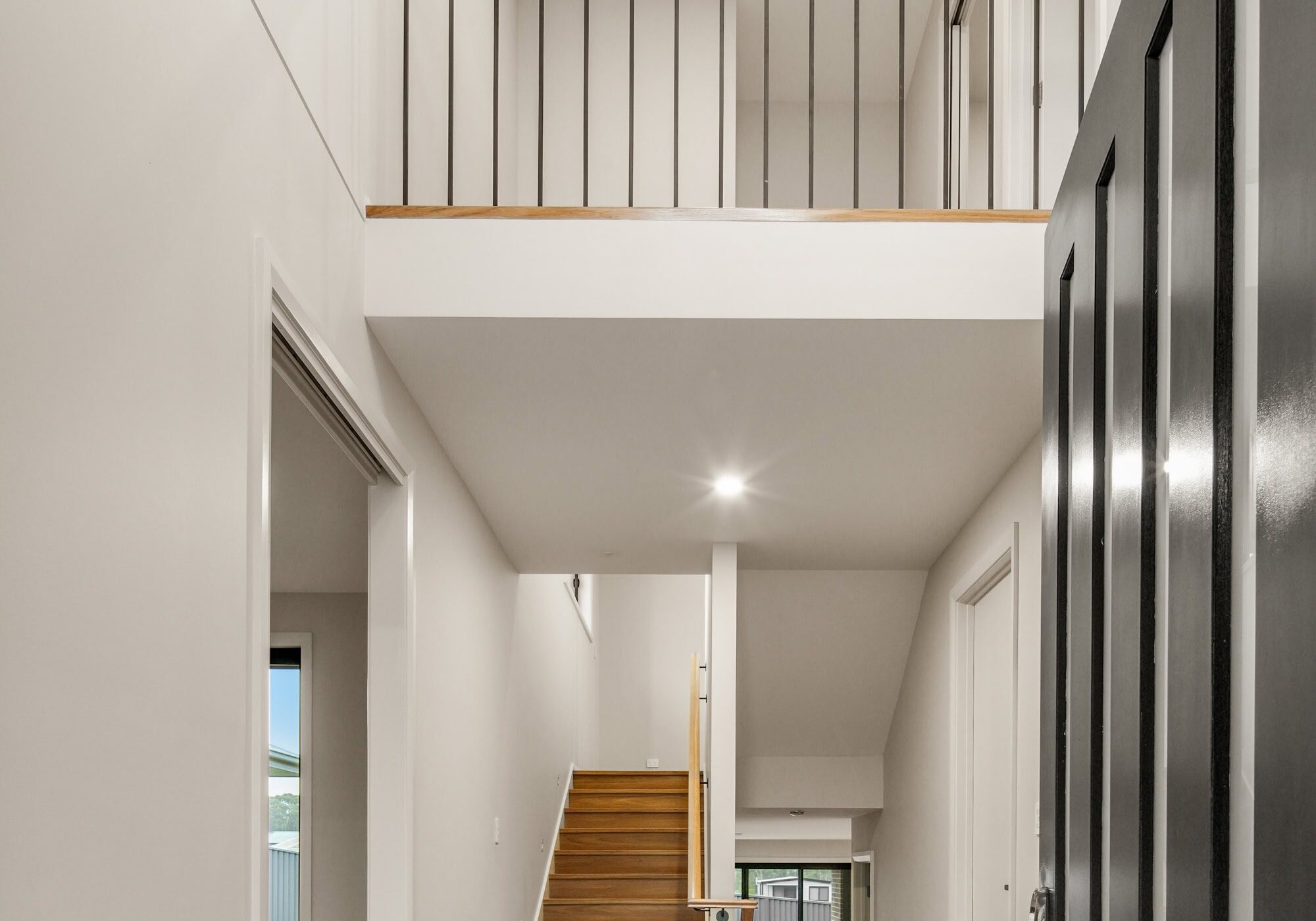 Modern two-storey home interior with staircase and open balcony. showing how Multi-Generational Second-Storey Extensions in Nirimba Fields can be achieved
